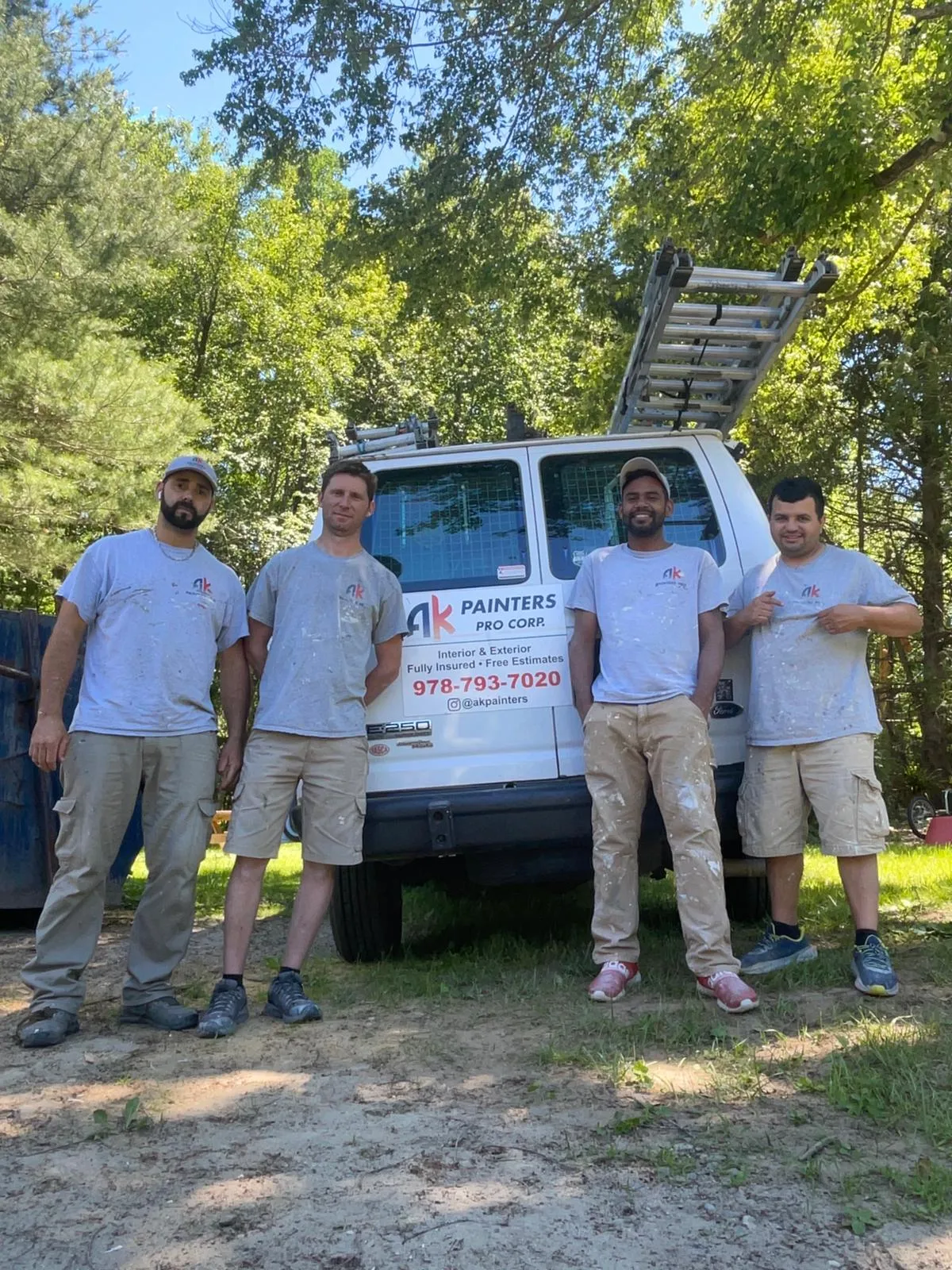 The AK Painters team beside their branded van